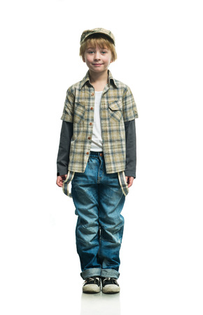 Cheerful boy in a jeans on the white backgroundの写真素材