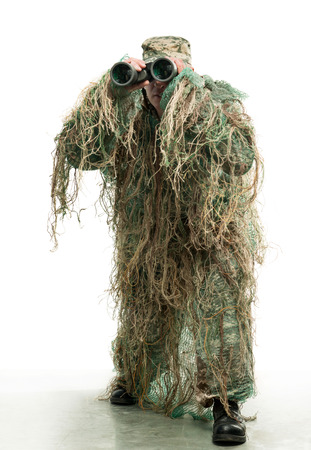 Soldier in camouflage with binocularsの写真素材