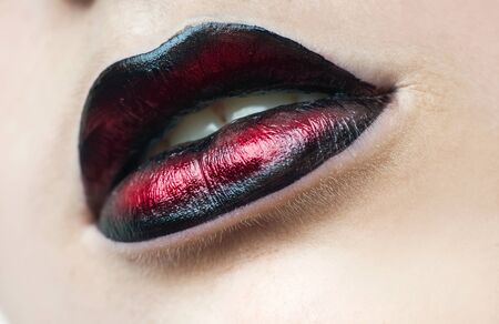 Bright lip makeup of a young womanの写真素材