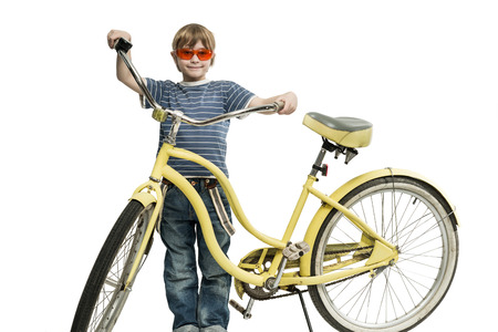 Boy with a yellow bicycleの写真素材