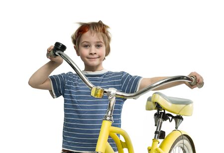 Boy with a yellow bicycleの写真素材