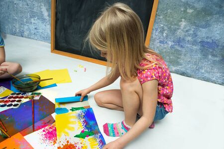 Little girl draws of water colorの写真素材