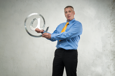 Man holding a sign of emailの写真素材