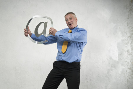 Man breaks sign of e-mailの写真素材