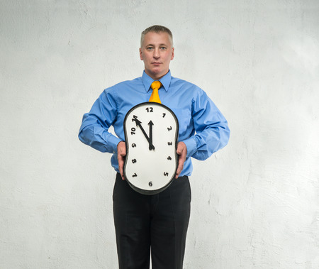 Compressed clock in the hands of manの写真素材