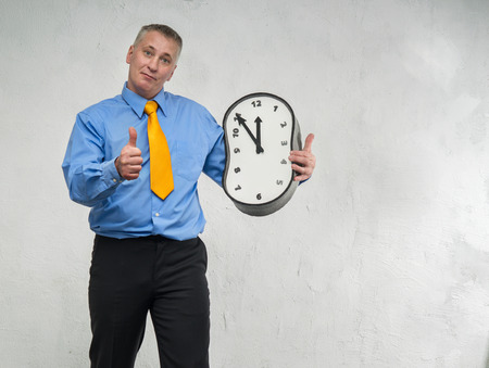 Clock without hands in the hands of manの写真素材