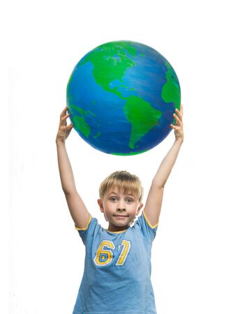 A little boy holding a globeの写真素材