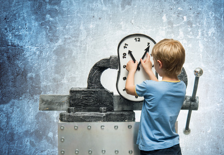 Boy takes the arrows on the clock