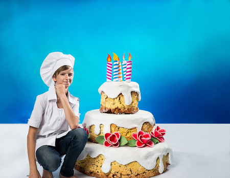 Cheerful confection with a birthday cakeの写真素材