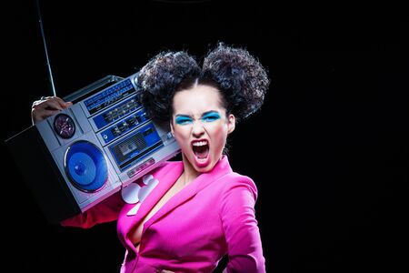 Bright disco girl with a tape recorderの写真素材