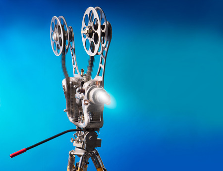 Movie projector with the film on the blue backgroundの写真素材