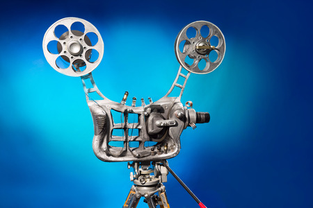 Movie projector with the film on the blue backgroundの写真素材