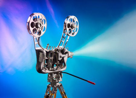 Movie projector with the film on the blue backgroundの写真素材