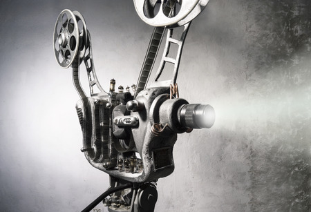 Movie projector with the reel film on the background of wallの写真素材