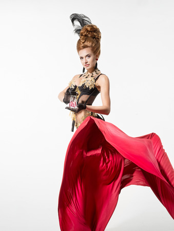 Beautiful woman in a beautiful lingerie and red fabricの写真素材