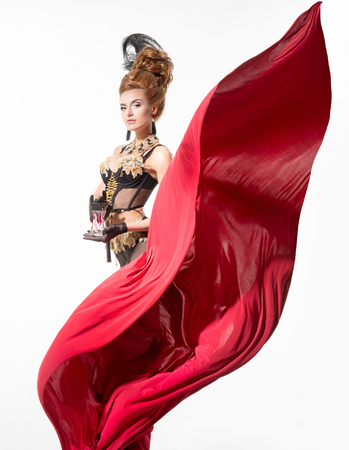 Beautiful woman in a beautiful lingerie and red fabricの写真素材