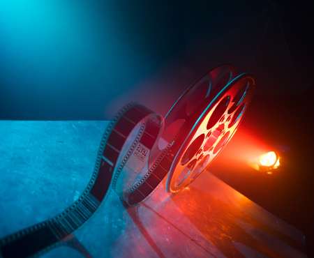 Red reel of film on a dark backgroundの写真素材