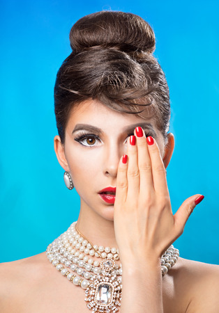 Portrait of a beautiful young woman with a manicureの写真素材