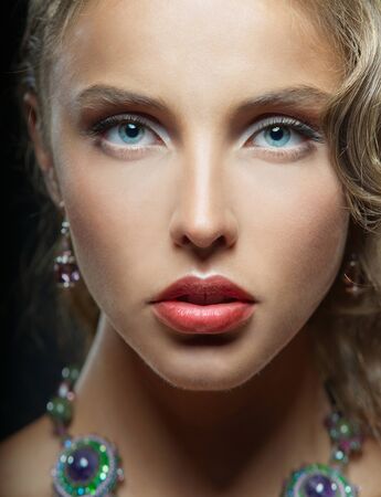 Portrait of charming woman with blue eyes and red lipsの写真素材