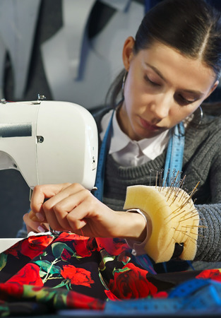 Seamstress working at a sewing machineの写真素材