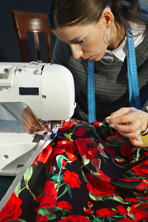 Seamstress working at a sewing machineの写真素材