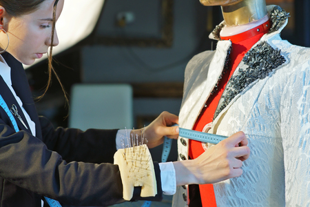 Couturier sews a dress in the studioの写真素材