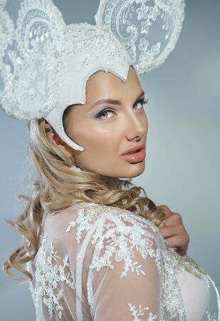 Portrait of a sexy woman in a white lace lingerie and super hatの写真素材
