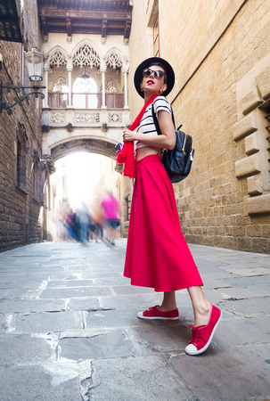 Tourism in Europe, woman tourist on the narrow street of Barcelonaの写真素材