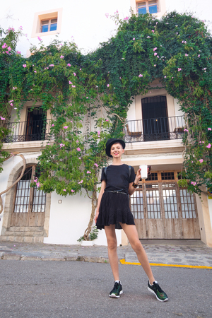 Tourism in Europe, woman tourist on the street near buildingの写真素材