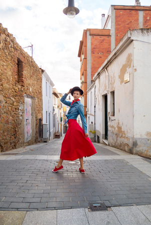 Pretty woman on the narrow street of old cityの写真素材