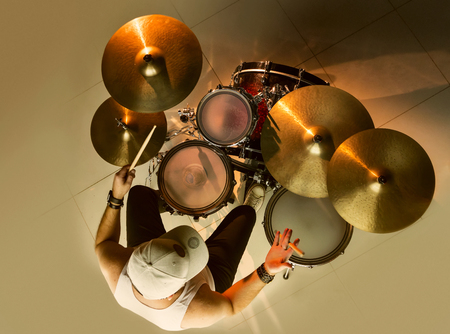 Musician plays musical percussion instrument with drumsticksの写真素材