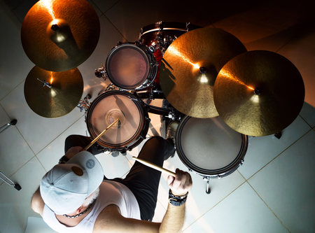 Musician plays musical percussion instrument with drumsticksの写真素材