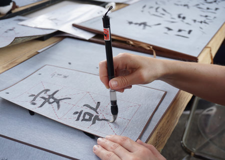 Study of hieroglyphs, shodo Japanese calligraphy brush writing process learningの写真素材