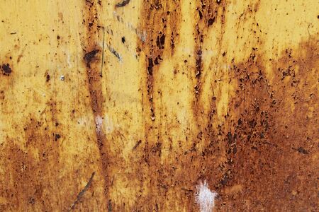 The texture of the metal yellow color with rusty sites