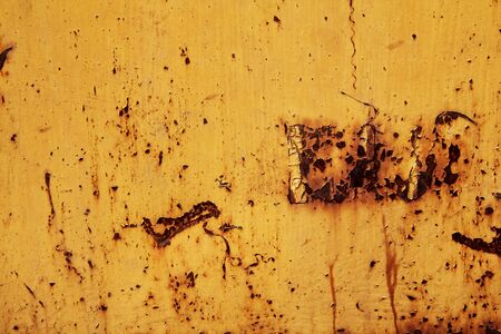 The texture of the metal yellow color with rusty sites