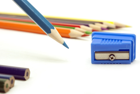 blue pencil and blue sharpener on a white backgroundの写真素材