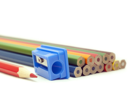 sharp red pencil a blue sharpener blunt pencils on a white backgroundの写真素材