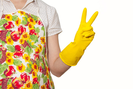 female torso wearing a white shirt in the color apron, hand in glove yellow, two thumbs up on a white backgroundの写真素材