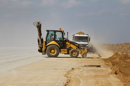 TULCEA, ROMANIA - NOVEMBER 08: Heavy construction equipment working on a runway construction site as...