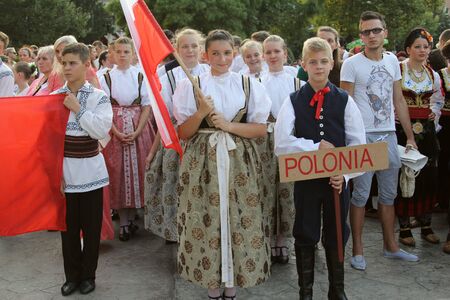 TULCEA, ROMANIA - AUGUST 08: Polish group of dancers in traditional costumes at the International Folklore Festival for Children and Youth Golden Fish on August 08, 2014 in Tulcea, Romania.のeditorial素材