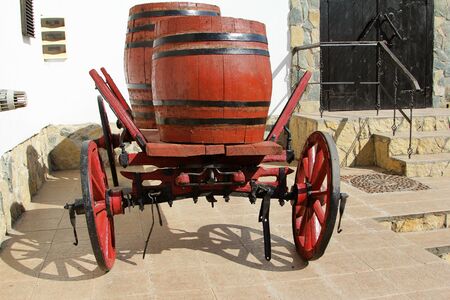 Old wooden wagon with wine barrelsの写真素材