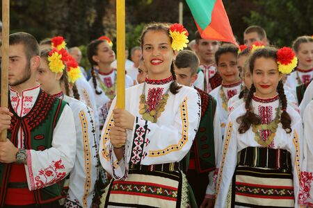 TULCEA, ROMANIA - AUGUST 08: Bulgarian group of dancers in traditional costumes at the International Folklore Festival for Children and Youth - Golden Fish on August 08, 2017 in Tulcea, Romaniaのeditorial素材