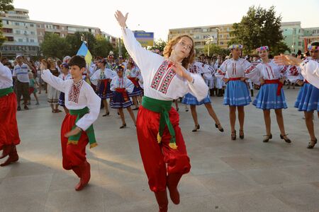 TULCEA, ROMANIA - AUGUST 08: Ukrainian group of dancers in traditional costumes at the International Folklore Festival for Children and Youth - Golden Fish on August 08, 2017 in Tulcea, Romaniaのeditorial素材