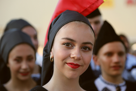 TULCEA, ROMANIA - AUGUST 08: Romanian dancer in traditional costume at the International Folklore Festival for Children and Youth - Golden Fish on August 08, 2018 in Tulcea, Romania.のeditorial素材