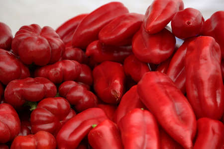 Freshly picked sweet red peppers at a local farmers marketの写真素材
