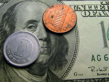  one yen,one cent on a 100 dollars bill-financial concept