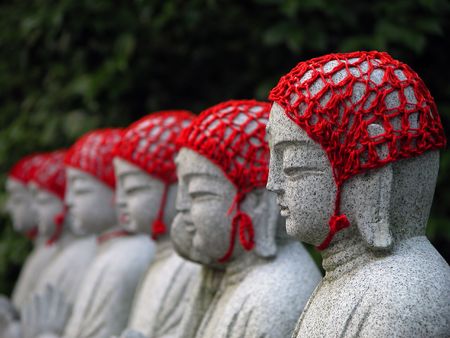 Row of Buddhist statues in a Japanese temple. Selective focus.の写真素材