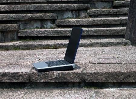 Laptop on the rocks stairsの写真素材