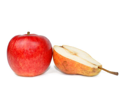 A red apple and a half of a pear over white backgroundの写真素材