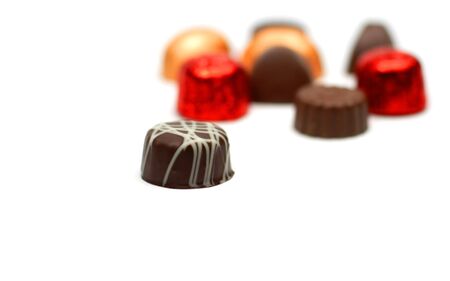 Fancy tasty chocolates over white background with selective focus.の写真素材